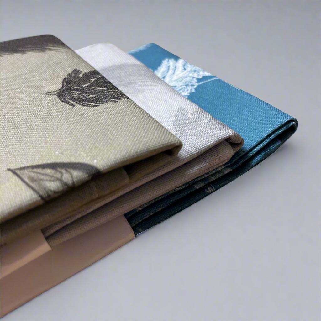 Four fabric swatches with different patterns on a gray background